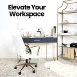 Modern home office with gold desk organizer set on navy desk. Enhances workspace with chic and functional office supplies.