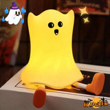 Silicone Ghost Lamp with soft yellow glow and orange shoes, perfect for Halloween bedside decor with touch control and waterproof design.