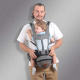 Gray ergonomic Baby Hip Seat Carrier with toddler, featuring wide shoulder straps and waist support. Ideal for baby transport and comfort.