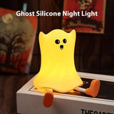 Ghost-shaped silicone night light glowing warmly, ideal for Halloween-themed bedrooms with touch-sensitive control and waterproof build.