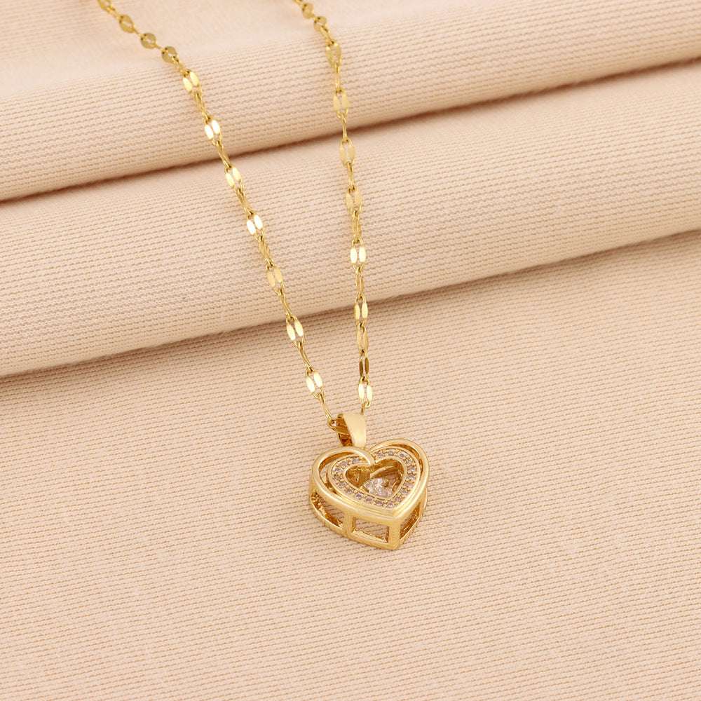 Titanium steel Love Necklace featuring a double-heart rhinestone pendant on a gold chain. Stylish accessory for fashion-forward women.