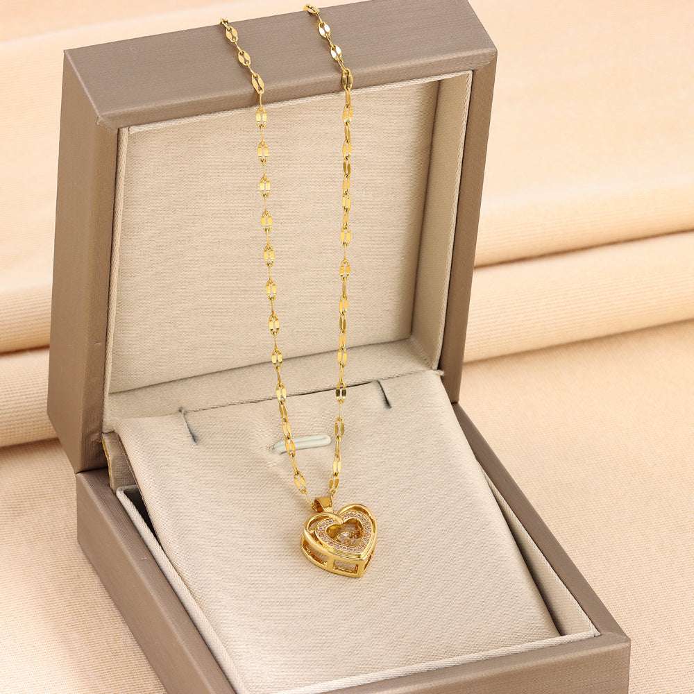 Double-layer heart pendant necklace in gold with rhinestones, presented in a luxury gift box. Perfect fashion jewelry for gifting.