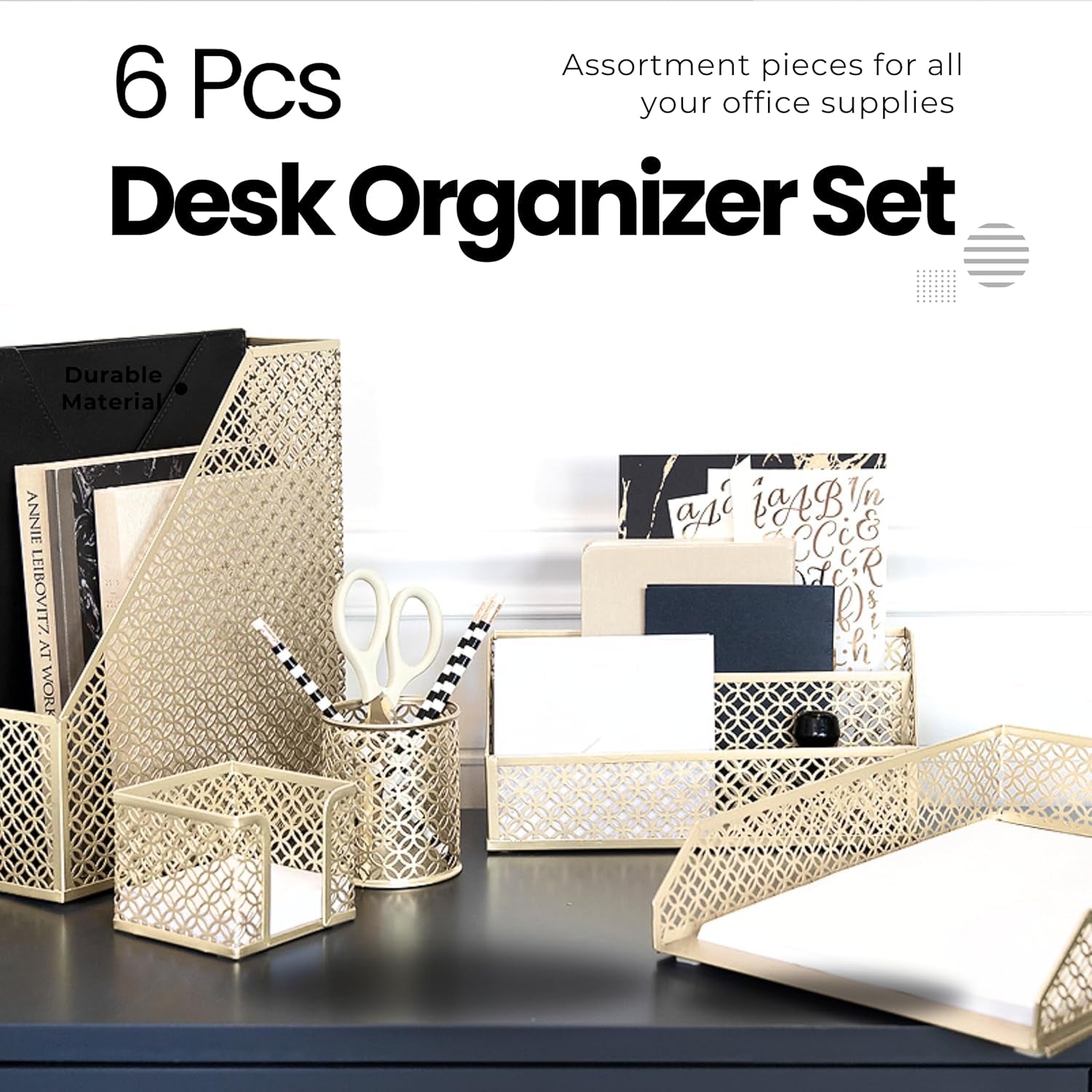 Stylish gold desk organizer set on black desk with assorted office supplies. Durable metal design for elegant workspace organization.