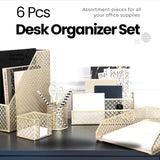 Stylish gold desk organizer set on black desk with assorted office supplies. Durable metal design for elegant workspace organization.