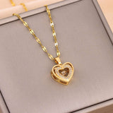 Love Necklace - Double-layer Steel Pendant in gold with rhinestone heart charm on twisted chain. Elegant fashion jewelry for women.