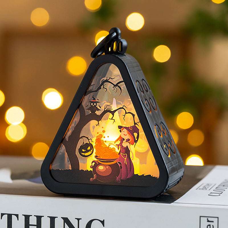 Halloween Portable Pumpkin Lamp featuring a witch stirring a cauldron under a spooky tree, perfect for festive and magical Halloween decor.
