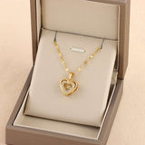 Gold Double-layer Love Necklace with rhinestone heart pendant displayed in a beige jewelry box. Ideal Valentines Day gift for women.