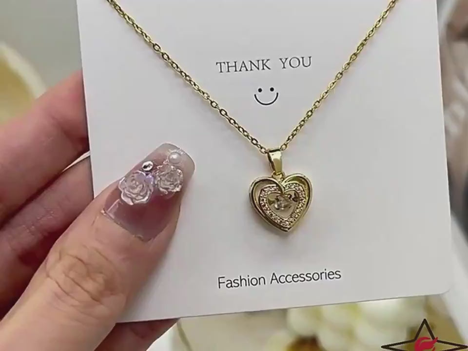 Gold heart-shaped Love Necklace with rhinestones shown on a thank you card. Fashion jewelry gift for women and special occasions.