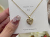Gold heart-shaped Love Necklace with rhinestones shown on a thank you card. Fashion jewelry gift for women and special occasions.